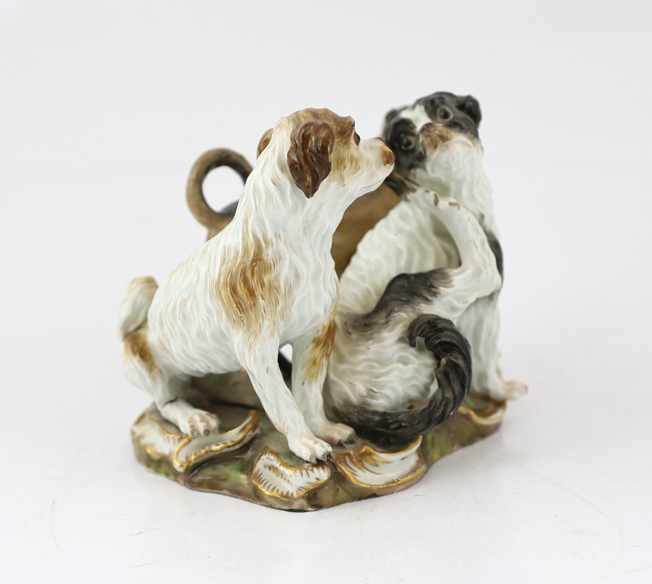 A Meissen group of two terriers and a pug-dog, modelled by Kandler, 19th century